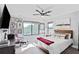 This main bedroom features a ceiling fan, a bright window, and gallery wall at 120 Vanira Se Ave, Atlanta, GA 30315