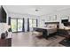 This main bedroom features a sliding glass door, a ceiling fan, and plenty of natural light at 120 Vanira Se Ave, Atlanta, GA 30315