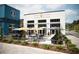 Exterior of Patria Cocina, with patio seating, umbrellas, and modern architecture at 120 Vanira Se Ave, Atlanta, GA 30315