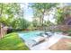 This pool area features lounge seating, landscaping, and a lush green lawn at 120 Vanira Se Ave, Atlanta, GA 30315