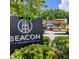Exterior signage for The Beacon, highlighting the address and surrounding greenery at 120 Vanira Se Ave, Atlanta, GA 30315