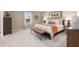 Cozy bedroom with neutral walls, carpet floors, decorative accents, and a well-lit atmosphere at 1208 Arnhem Dr, Hampton, GA 30228