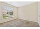 Bright bedroom with neutral carpeting, a window with blinds, and a fresh, clean ambiance at 1212 Ashton Park Dr, Lawrenceville, GA 30045