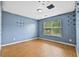 Spacious bedroom with a window view and wood-style flooring, awaiting personalization and decor at 1212 Ashton Park Dr, Lawrenceville, GA 30045