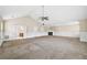 Spacious living room showing carpet flooring, a fireplace, and high ceilings at 1212 Ashton Park Dr, Lawrenceville, GA 30045