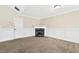 Bright living room featuring crown molding, neutral walls, and a marble fireplace at 1212 Ashton Park Dr, Lawrenceville, GA 30045