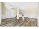 Open-concept living room displaying wood floors, staircase, crown molding, and ample natural light at 1212 Ashton Park Dr, Lawrenceville, GA 30045