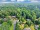Community aerial view of several homes on large wooded lots with a cul-de-sac street at 1625 Clark Lake Nw Dr, Acworth, GA 30102