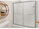 Bathroom shower with sliding glass doors and a plant on a shelf at 1625 Clark Lake Nw Dr, Acworth, GA 30102