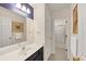 Bathroom featuring tiled floors, a vanity sink, and a shower at 1625 Clark Lake Nw Dr, Acworth, GA 30102
