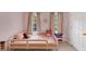 This bedroom features a twin bed and ample natural light with neutral paint at 1625 Clark Lake Nw Dr, Acworth, GA 30102