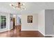 Stylish dining area with hardwood floors, modern lighting, and adjacent access to the kitchen at 1625 Clark Lake Nw Dr, Acworth, GA 30102