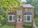 Charming two-story brick home with a large front window, bay windows, and landscaped front yard at 1625 Clark Lake Nw Dr, Acworth, GA 30102
