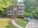 Classic brick home with beautiful architectural details and a well-maintained front yard at 1625 Clark Lake Nw Dr, Acworth, GA 30102