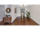 Open hallway into the kitchen featuring hardwood floors, access to a view, and ample walking space at 1625 Clark Lake Nw Dr, Acworth, GA 30102