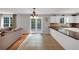 Bright kitchen featuring granite countertops, white cabinets, and a view to the yard through French doors at 1625 Clark Lake Nw Dr, Acworth, GA 30102