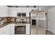 Kitchen with stainless steel refrigerator, microwave, and modern countertops at 1625 Clark Lake Nw Dr, Acworth, GA 30102