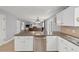 Kitchen featuring stainless steel dishwasher and view into the living room at 1625 Clark Lake Nw Dr, Acworth, GA 30102