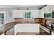 Well-lit kitchen with stainless steel appliances and granite counters at 1625 Clark Lake Nw Dr, Acworth, GA 30102