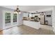 Eat-in kitchen with white cabinetry, stainless steel appliances and backyard access at 1625 Clark Lake Nw Dr, Acworth, GA 30102