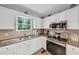 Bright kitchen featuring stainless steel appliances and stone countertops at 1625 Clark Lake Nw Dr, Acworth, GA 30102
