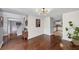 Spacious living area with hardwood floors, neutral paint, and easy access to the kitchen and stairs at 1625 Clark Lake Nw Dr, Acworth, GA 30102