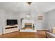 Cozy living room with a fireplace, TV, and comfortable seating at 1625 Clark Lake Nw Dr, Acworth, GA 30102