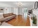 Bright living room showcasing hardwood floors, fireplace, and modern paint colors at 1625 Clark Lake Nw Dr, Acworth, GA 30102