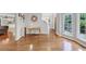 Open-concept living space with hardwood floors and natural lighting, including desk at 1625 Clark Lake Nw Dr, Acworth, GA 30102