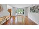 Bright living room featuring hardwood floors, and a large bay window at 1625 Clark Lake Nw Dr, Acworth, GA 30102