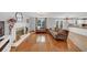 Cozy living room featuring a fireplace, hardwood floors, comfortable seating, and backyard views at 1625 Clark Lake Nw Dr, Acworth, GA 30102