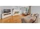 Comfortable living room with hardwood floors, fireplace, and natural lighting at 1625 Clark Lake Nw Dr, Acworth, GA 30102