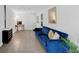 Finished basement living room with durable floors and comfortable blue velvet sofa at 1625 Clark Lake Nw Dr, Acworth, GA 30102