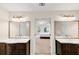 The main bathroom features a double vanity with framed mirrors and bedroom access at 1625 Clark Lake Nw Dr, Acworth, GA 30102