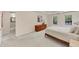 Open main bedroom with neutral walls, carpet floors, a tray ceiling, with views of connecting rooms at 1625 Clark Lake Nw Dr, Acworth, GA 30102