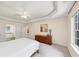 Spacious main bedroom featuring a tray ceiling and ensuite bath access through double doors at 1625 Clark Lake Nw Dr, Acworth, GA 30102