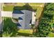 An aerial view of the house shows the well-maintained roof, concrete patio, and landscaped backyard with mature trees at 3313 Harmon Ridge Ct, Buford, GA 30519