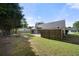 Expansive backyard featuring a fire pit, patio, and privacy fence, creating a versatile outdoor area at 3313 Harmon Ridge Ct, Buford, GA 30519