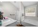 Bright bathroom featuring a soaking tub, separate shower, and a modern vanity with sink at 3313 Harmon Ridge Ct, Buford, GA 30519