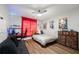 Cozy bedroom with wood floors, unique lighting, and vibrant decor, perfect for a teenager or young adult at 3313 Harmon Ridge Ct, Buford, GA 30519
