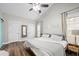 Vaulted bedroom with neutral tones, modern decor, wood floors, and abundant natural light through large windows at 3313 Harmon Ridge Ct, Buford, GA 30519