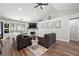 Bright living room with vaulted ceilings, wood floors, and stylish wall art at 3313 Harmon Ridge Ct, Buford, GA 30519