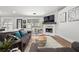 Comfortable living room with a marble fireplace, stylish decor, and a view of the backyard at 3313 Harmon Ridge Ct, Buford, GA 30519