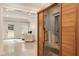 Basement showcasing a sauna and a lounging area with comfortable seating and natural light from the walkout door at 390 Hembree Rd, Roswell, GA 30075