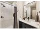 Modern bathroom design with a marble tiled shower, sleek vanity, and contemporary fixtures at 390 Hembree Rd, Roswell, GA 30075