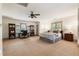 Spacious main bedroom with sitting area and a large bed, complemented by ample natural light and neutral tones at 390 Hembree Rd, Roswell, GA 30075