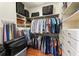 Organized walk-in closet featuring ample hanging space, built-in drawers, and shelving for luggage and accessories at 390 Hembree Rd, Roswell, GA 30075