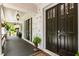 Inviting front entrance with double doors and covered porch at 390 Hembree Rd, Roswell, GA 30075
