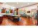 Spacious kitchen with dark wood cabinets, large island, and stainless steel appliances at 390 Hembree Rd, Roswell, GA 30075