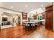 Open kitchen with wood floors, large island, state-of-the-art appliances, and abundant natural light at 390 Hembree Rd, Roswell, GA 30075
